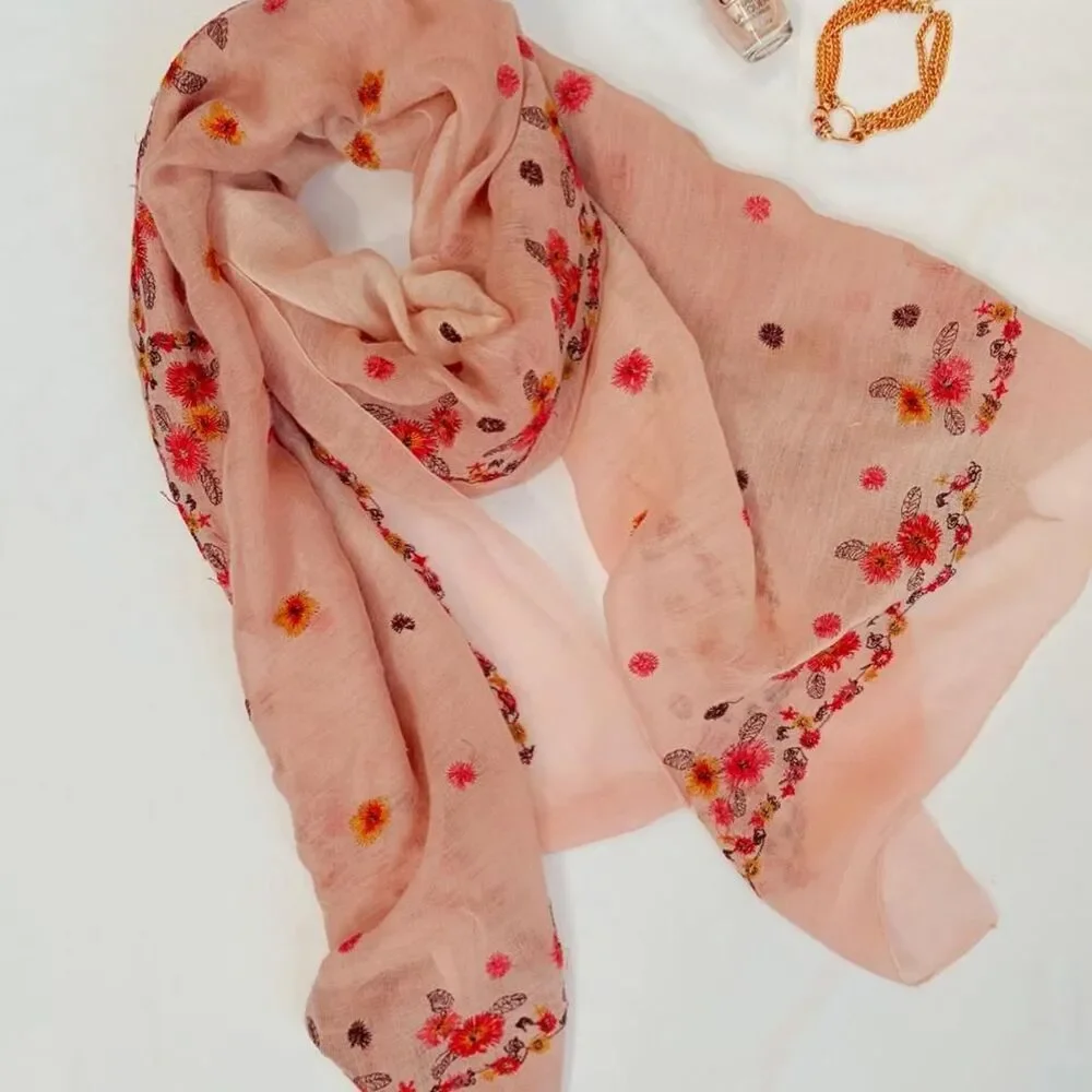 Light pink silk scarf featuring dainty floral embroidery